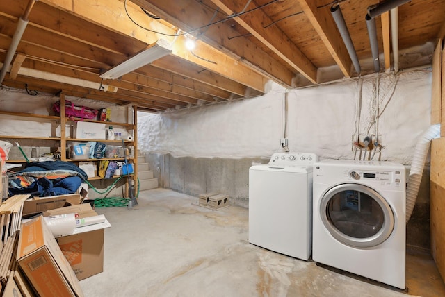laundry area with washing machine and clothes dryer and laundry area