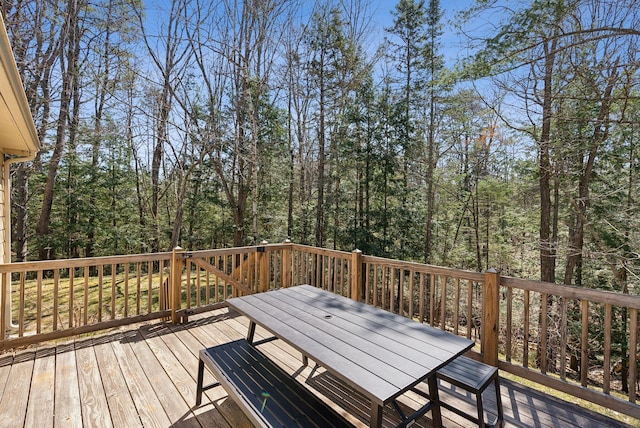 wooden deck with outdoor dining area