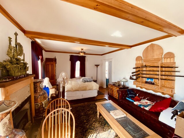 living room with wood finished floors, beam ceiling, and crown molding