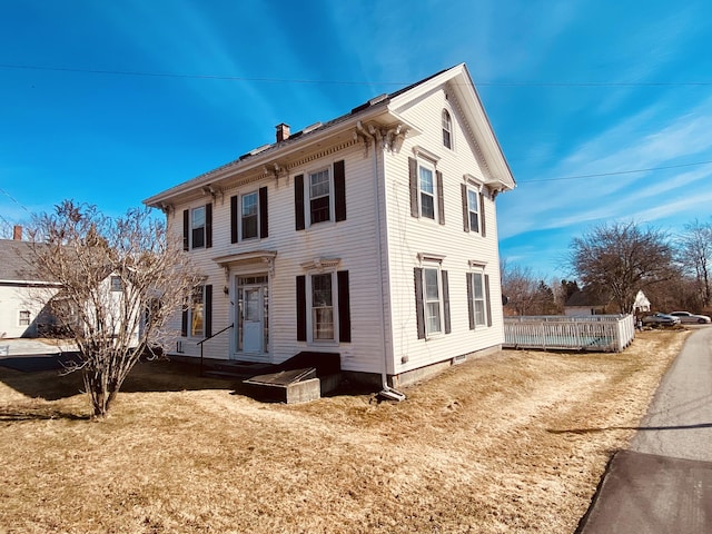 italianate-style house with a chimney