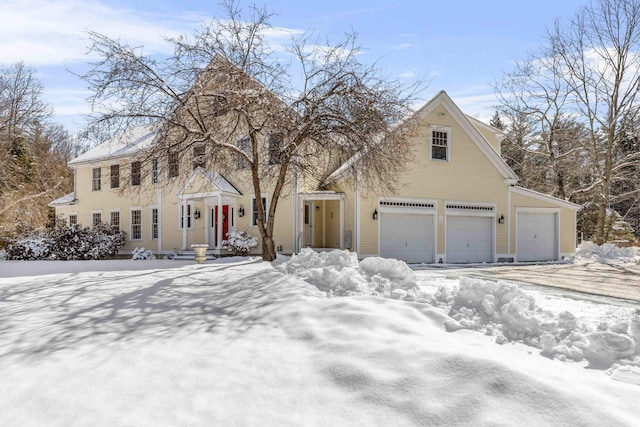 colonial inspired home with a garage