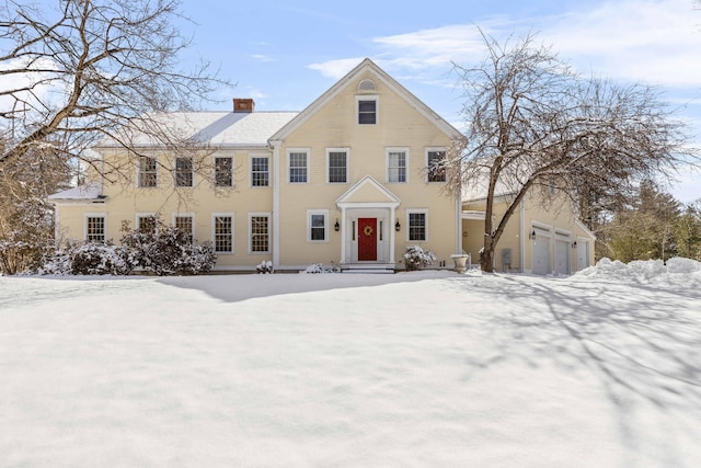 colonial home featuring a chimney