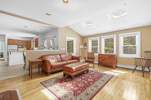 living room featuring vaulted ceiling with skylight, recessed lighting, a baseboard radiator, and light wood-type flooring