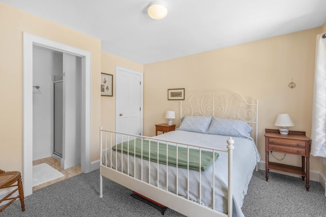 carpeted bedroom featuring baseboards
