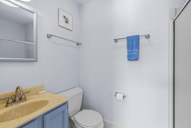 full bath with vanity, a shower, and toilet