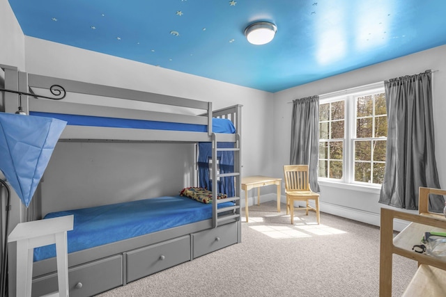 carpeted bedroom with a baseboard radiator
