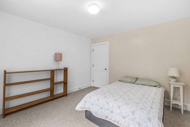 bedroom featuring carpet floors and baseboards