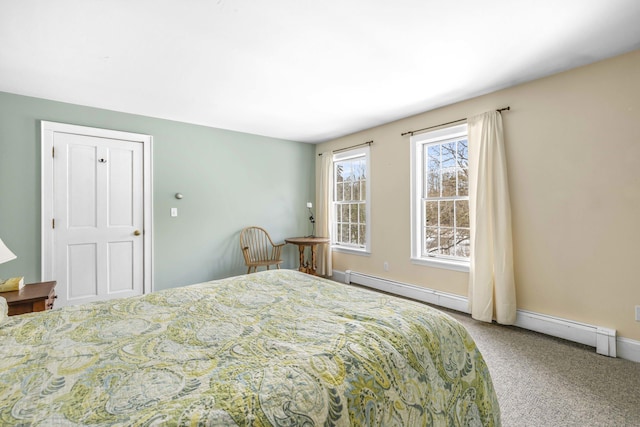 bedroom featuring baseboards, a baseboard radiator, and carpet flooring