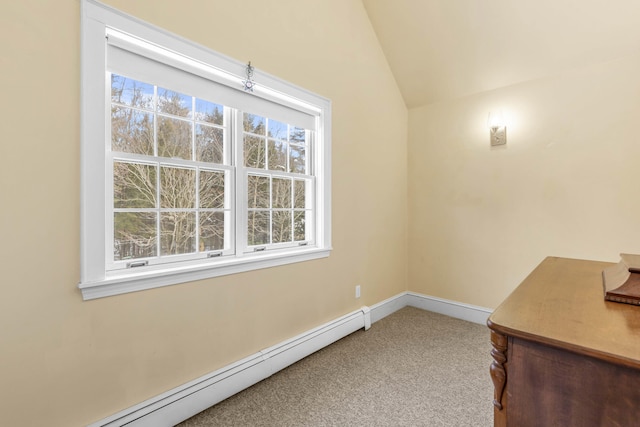 unfurnished office featuring carpet flooring, lofted ceiling, a baseboard heating unit, and a wealth of natural light