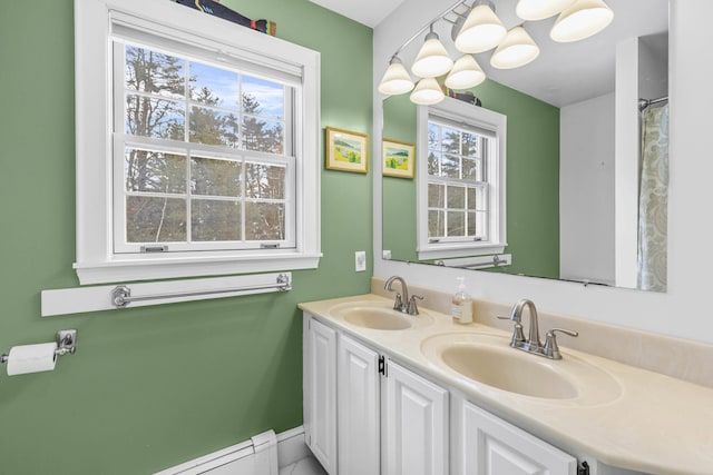 full bathroom with double vanity and a sink