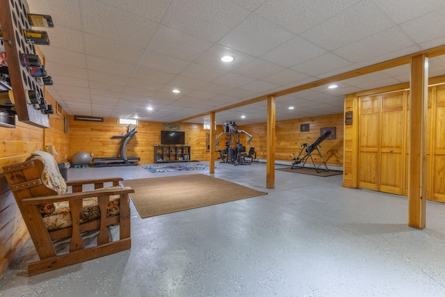 interior space with wood walls and recessed lighting