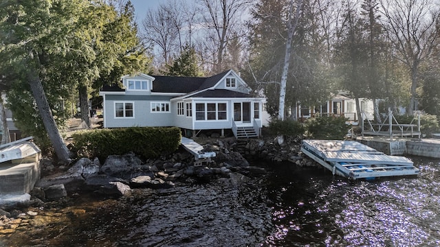 back of property featuring a sunroom