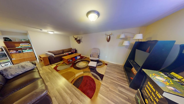 living room featuring baseboards and wood finished floors