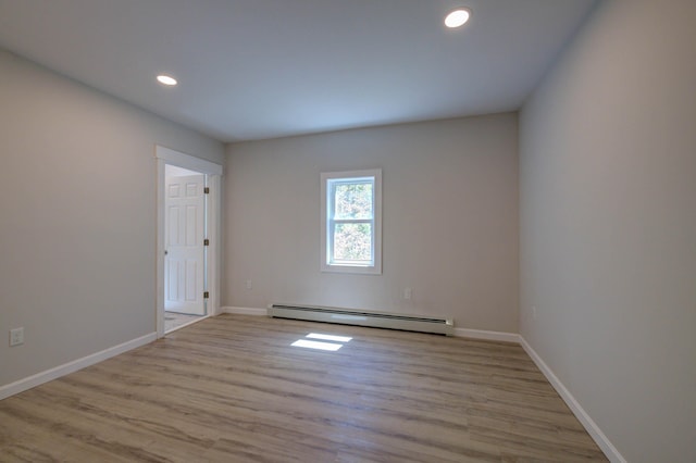 313 W Neck Rd, Nobleboro, ME 04555 - empty room with a baseboard radiator, wood finished floors, baseboards, and recessed lighting