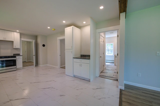 313 W Neck Rd, Nobleboro, ME 04555 - kitchen with stainless steel electric range, recessed lighting, dark countertops, white cabinets, and baseboards