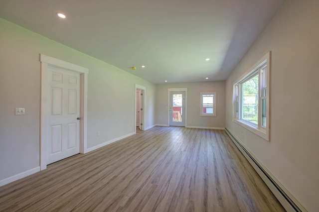313 W Neck Rd, Nobleboro, ME 04555 - spare room featuring a baseboard radiator, wood finished floors, recessed lighting, and baseboards