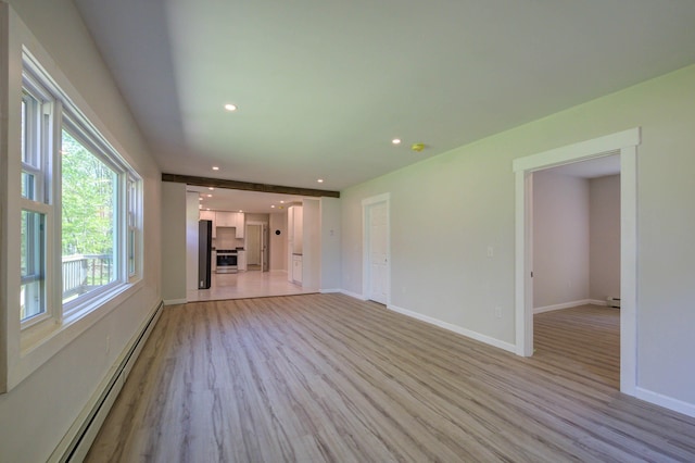 313 W Neck Rd, Nobleboro, ME 04555 - unfurnished living room featuring baseboard heating, light wood finished floors, baseboards, and recessed lighting