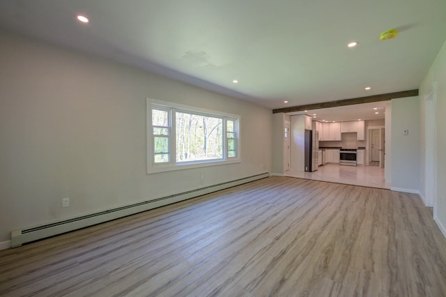 313 W Neck Rd, Nobleboro, ME 04555 - unfurnished living room with a baseboard heating unit, light wood-type flooring, recessed lighting, and baseboards