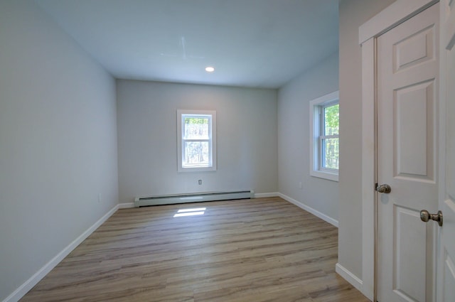 313 W Neck Rd, Nobleboro, ME 04555 - spare room with a baseboard radiator, light wood-style floors, baseboards, and recessed lighting