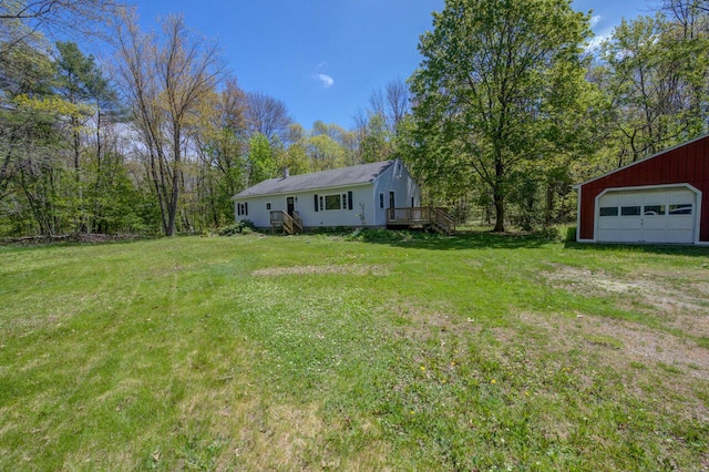 313 W Neck Rd, Nobleboro, ME 04555 - view of green lawn featuring a detached garage, an outbuilding, and stairway