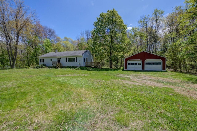 313 W Neck Rd, Nobleboro, ME 04555 - view of green lawn with a garage, an outdoor structure, and driveway