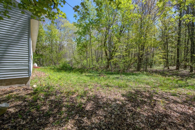 313 W Neck Rd, Nobleboro, ME 04555 - view of yard with a wooded view