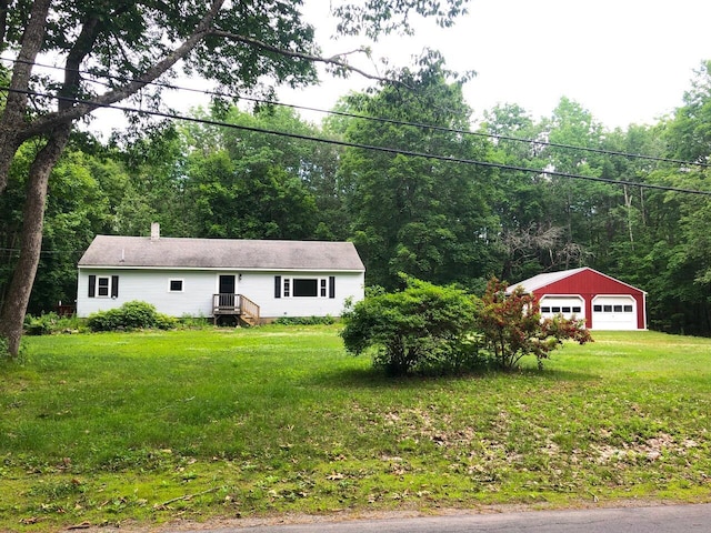 313 W Neck Rd, Nobleboro, ME 04555 - ranch-style house featuring a detached garage, a front yard, an outbuilding, and a wooded view