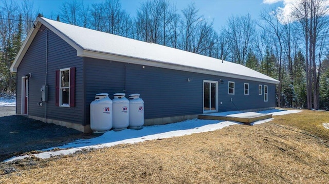 rear view of house with a yard