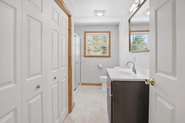 full bath with vanity, visible vents, toilet, a stall shower, and baseboards