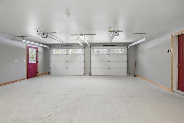 garage featuring baseboards and a garage door opener