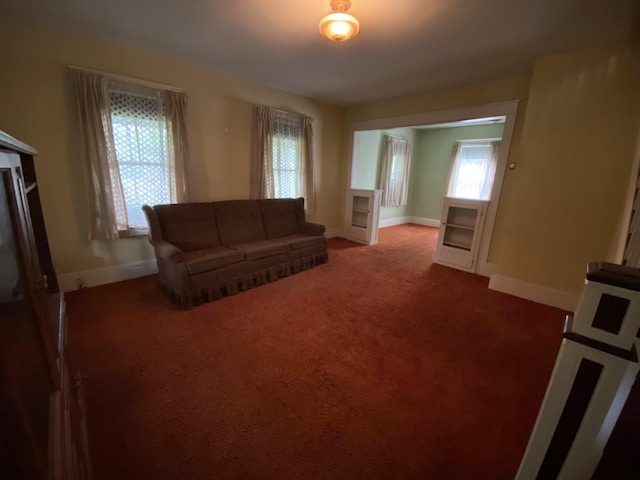 927 Van Buren Rd, Caswell, ME 04750 - carpeted living area with a wealth of natural light and baseboards