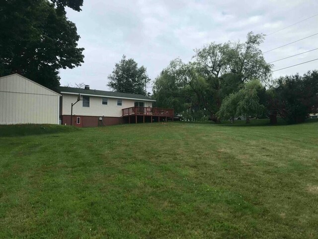 191 Water St, Eastport, ME 04631 - view of green lawn with a deck