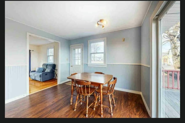 191 Water St, Eastport, ME 04631 - dining room with wood finished floors, wainscoting, and baseboards