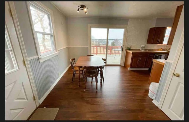 191 Water St, Eastport, ME 04631 - dining area featuring dark wood-style floors