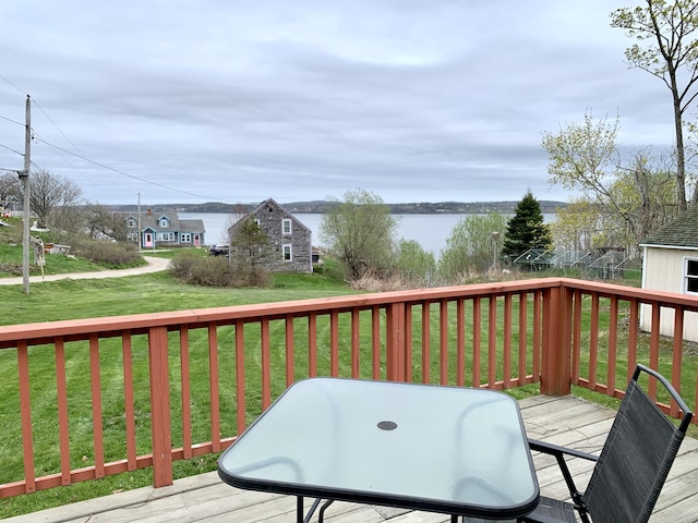 191 Water St, Eastport, ME 04631 - wooden terrace featuring a lawn, a water view, and outdoor dining area