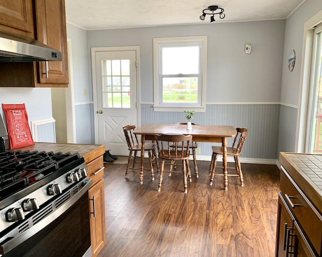 191 Water St, Eastport, ME 04631 - dining space with dark wood finished floors and wainscoting