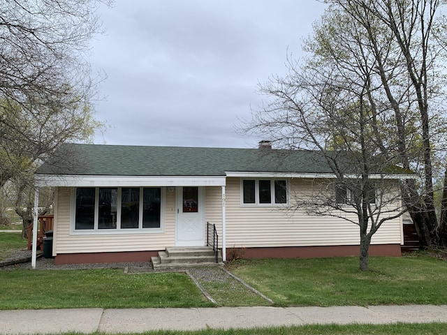 191 Water St, Eastport, ME 04631 - bungalow-style house with entry steps, a front lawn, and a shingled roof