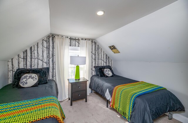 bedroom featuring carpet floors and vaulted ceiling