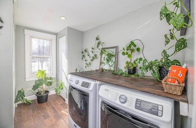 laundry room with recessed lighting, washer and clothes dryer, laundry area, baseboards, and dark wood finished floors