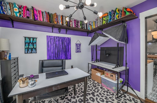 office area featuring an inviting chandelier