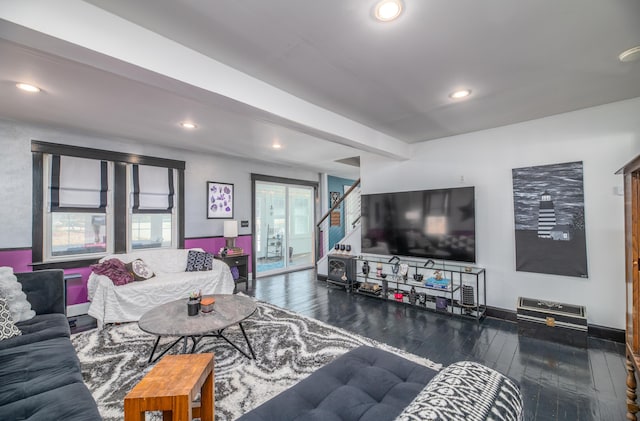 living room with recessed lighting, stairs, hardwood / wood-style floors, and baseboards