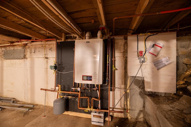 utility room featuring water heater