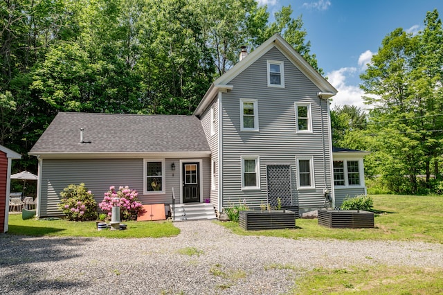 3 Adell Rd, Readfield, ME 04355 - view of front of property with a front lawn, a chimney, and a shingled roof
