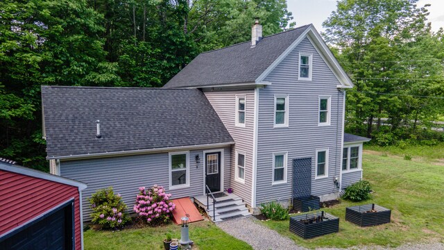3 Adell Rd, Readfield, ME 04355 - view of front facade with a chimney, roof with shingles, and a front yard