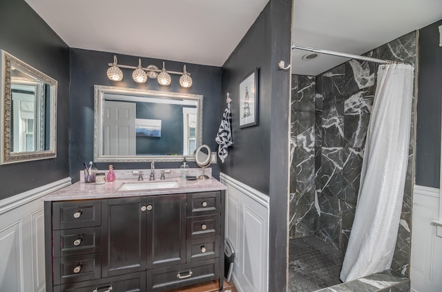 3 Adell Rd, Readfield, ME 04355 - full bath with a wainscoted wall, a shower stall, vanity, and a decorative wall