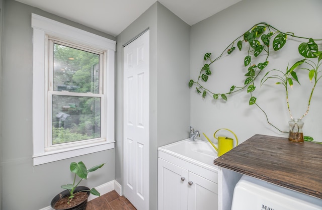 3 Adell Rd, Readfield, ME 04355 - laundry room with cabinet space and dark wood-style flooring