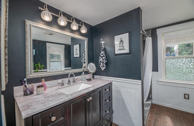 3 Adell Rd, Readfield, ME 04355 - bathroom featuring vanity, wood finished floors, wainscoting, and a shower with shower curtain