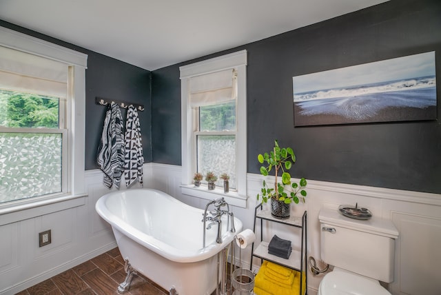 3 Adell Rd, Readfield, ME 04355 - full bathroom featuring a wainscoted wall, a freestanding tub, and wood finished floors