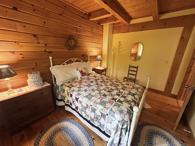 362 N Raymond Rd, Poland, ME 04274 - bedroom with hardwood / wood-style flooring, wooden walls, and a wood ceiling with exposed beams