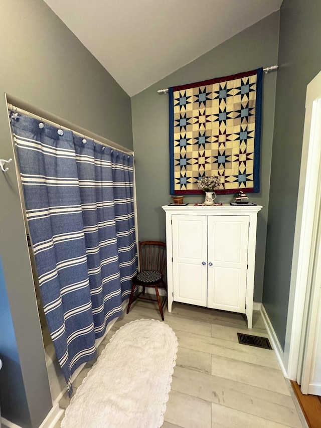 362 N Raymond Rd, Poland, ME 04274 - bathroom with lofted ceiling and wood finished floors